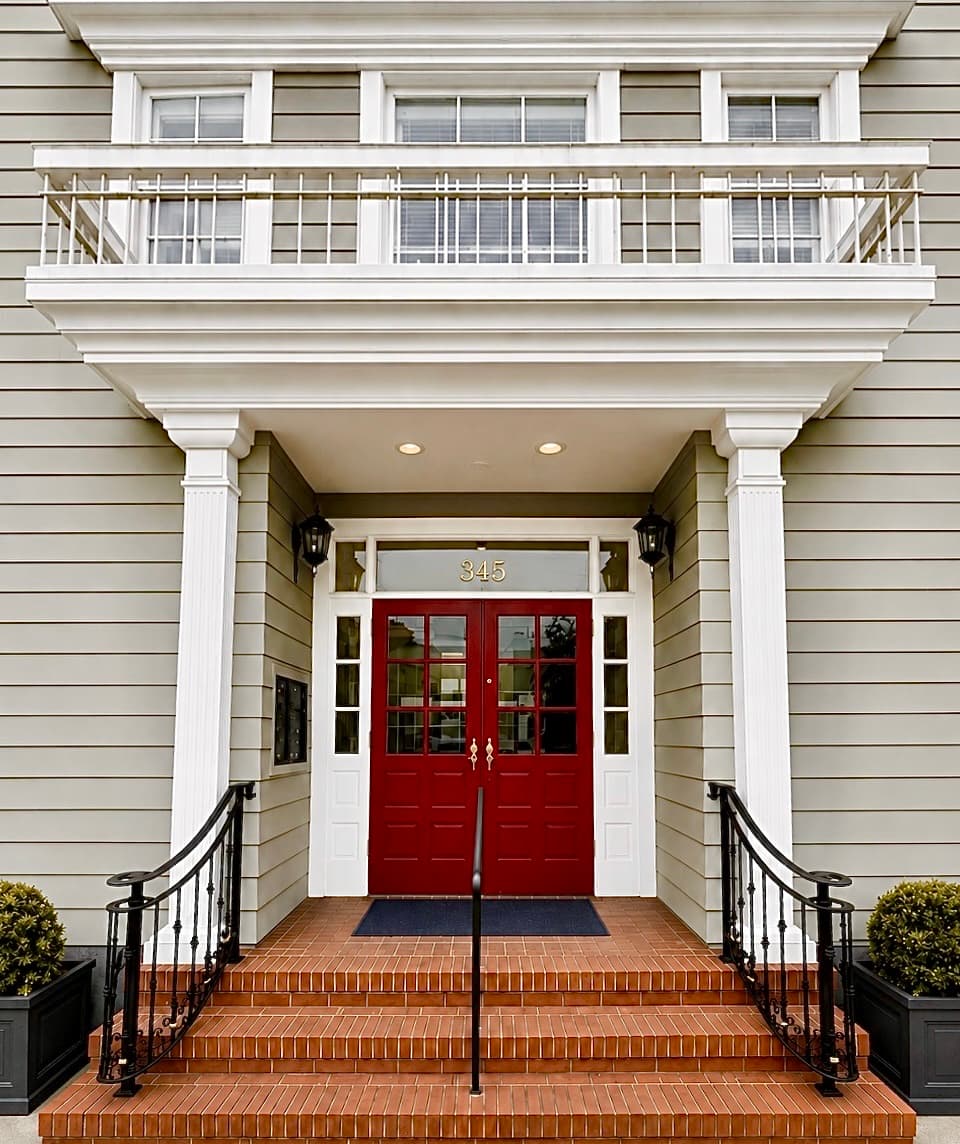 The red front door of The Practice SF at 345 West Portal Avenue